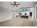 Open-concept kitchen and living area with a large island and modern lighting at 60 E Jaybird St, Pahrump, NV 89048
