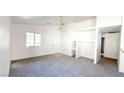 View of the living room that features fresh white paint and new carpets at 6533 Adonis Heights Ave, North Las Vegas, NV 89086