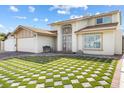 Charming two-story home with unique grass block lawn and neutral paint at 6775 Segura Dr, Las Vegas, NV 89103