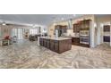 A generously sized gourmet kitchen featuring granite countertops and high-end stainless steel appliances at 7331 Abundant Harvest Ave, Las Vegas, NV 89131