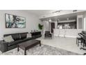 Modern living room with a comfortable sofa, stylish decor, and a view into the kitchen at 8255 Las Vegas Blvd # 1908, Las Vegas, NV 89123