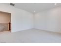 Spacious bedroom with recessed lighting and white carpet, offering a serene and comfortable living space at 11940 Vector Ray Ave, Las Vegas, NV 89138