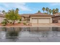 Lovely single story home featuring desert landscaping, a tile roof, and a two-car garage at 1433 Erskine Ave, Las Vegas, NV 89123