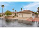 Beautiful single story home featuring desert landscaping, a tile roof, and a two-car garage at 1433 Erskine Ave, Las Vegas, NV 89123