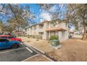Well-maintained multi-Gathering home featuring a tile roof, tidy landscaping, and convenient parking spaces for residents and guests at 2606 S Durango Dr # 152, Las Vegas, NV 89117