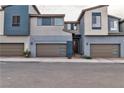 Contemporary townhouse showcasing a modern front facade and two-car garage at 2699 Chance Canyon St, Henderson, NV 89044