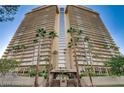 Exterior of Regency Towers featuring a high-rise condo with balconies and palm trees at 3111 Bel Air Dr # 20D, Las Vegas, NV 89109
