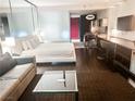 Open floor plan featuring a king bed, seating area, and modern kitchenette at 4381 W Flamingo Rd # 2109, Las Vegas, NV 89103
