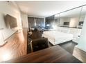 Modern bedroom suite boasts a king bed, seating area and desk space at 4381 W Flamingo Rd # 2109, Las Vegas, NV 89103