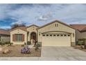 Inviting single-story home featuring a large two-car garage, desert landscaping, and a cozy front entrance at 538 Cypress Gardens Pl, Henderson, NV 89012