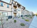Desirable townhome showcasing desert landscaping and a sidewalk at 538 Ylang Pl, Henderson, NV 89015
