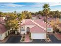 Aerial view of the home with a red tiled roof and desert landscaping at 726 Sea Pines Ln, Las Vegas, NV 89107