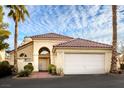 Home's exterior showcasing the garage, front door, and tiled roof at 726 Sea Pines Ln, Las Vegas, NV 89107