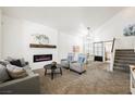 Bright living room featuring a fireplace, modern décor, and an open floor plan at 841 Glitter Glen Ct, Las Vegas, NV 89123