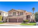 Charming two-story home with a three-car garage, tile roof, and well-maintained lawn at 9378 Chateau St Jean Dr, Las Vegas, NV 89123