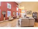 Bright living room with soaring ceilings, abundant natural light, and hardwood floors at 9378 Chateau St Jean Dr, Las Vegas, NV 89123