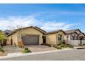 Beautiful single-story house showcasing mature desert landscaping and a brick driveway at 97 Sarabeth St, Las Vegas, NV 89138