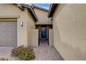 Inviting front door entrance with stone pathway and desert landscaping at 97 Sarabeth St, Las Vegas, NV 89138