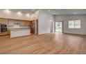Open-concept living room and kitchen area with wood floors and natural light at 97 Sarabeth St, Las Vegas, NV 89138