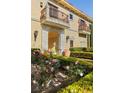 Mediterranean-style home featuring a private balcony and stone archway at 9940 Orient Express Ct, Las Vegas, NV 89145