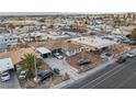 Aerial view of a residential property with a well-maintained front yard and ample parking at 1100 H St, Las Vegas, NV 89106