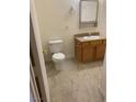 Standard bathroom featuring a toilet, vanity, and neutral flooring at 2060 Rancho Lake Dr # 202, Las Vegas, NV 89108