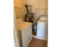 Functional laundry area with a washer, dryer, and water heater at 2060 Rancho Lake Dr # 202, Las Vegas, NV 89108