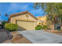 Inviting single-story home with an attached two car garage at 212 Duck Hollow Ave, Las Vegas, NV 89148