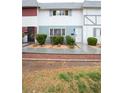Townhouse-style home with tidy landscaping at 223 Greenbriar Townhouse Way, Las Vegas, NV 89121