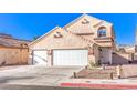 Attractive stucco home with a two-car garage, tiled roof, and desert-friendly landscaping at 4125 Glenfield Cir, Las Vegas, NV 89129