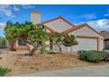 Beautiful single-story home showcases desert landscaping and an attached two-car garage at 630 Otono Dr, Boulder City, NV 89005