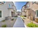 Community street view featuring modern architecture and landscaping creating inviting curb appeal at 7348 N Decatur Blvd # 5, Las Vegas, NV 89131