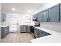 Updated kitchen with stainless steel appliances, quartz counters, and shaker style cabinets at 1009 Upland Blvd, Las Vegas, NV 89107