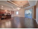Open floor plan featuring chandelier lighting and a large sliding glass door to the patio at 2405 Serene Ave # 241, Las Vegas, NV 89123