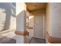 Inviting front entrance featuring a decorative security door and textured stucco walls at 320 Ellen Marie Dr, Las Vegas, NV 89110