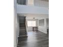 Spacious living room with high ceilings and modern gray flooring at 5830 Springmist St, North Las Vegas, NV 89031