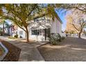 Charming multi-level townhome with mature trees and sidewalk at 647 Greenbriar Townhouse Way, Las Vegas, NV 89121