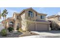 Charming two-story home with a three-car garage, well-kept landscaping, and an inviting facade in a serene neighborhood at 9417 Grenville Ave, Las Vegas, NV 89134