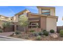 Charming two-story home with a landscaped yard, modern design, and a single car garage at 13 Scenic Terrain Ave, Henderson, NV 89011