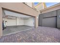Spacious two-car garage with ample storage and a paved driveway, offering convenience at 13 Scenic Terrain Ave, Henderson, NV 89011