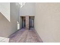 A private entrance features brick pavers and a stone accent pillar, providing a welcoming path at 234 Walsh Peak Ave, Henderson, NV 89015