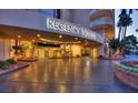 Well lit Regency Towers entrance boasts meticulous landscaping and a welcoming covered area at 3111 Bel Air Dr # 15D, Las Vegas, NV 89109