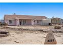 Charming single-story home featuring a desert landscape, covered front porch, and distinctive horse-themed address marker at 3581 Ranger Way, Pahrump, NV 89048
