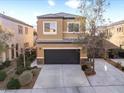Two-story home with an attached garage and landscaped front yard at 3719 Gilmore Creek St, Las Vegas, NV 89129