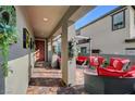 Inviting covered patio with comfortable seating, perfect for outdoor relaxation at 394 Red Feather Peak Ct, Las Vegas, NV 89138