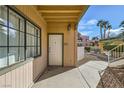 Building front entrance shows unit door, walkway, and view of the street at 5162 S Jones Blvd # 108, Las Vegas, NV 89118