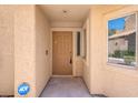 Close up of the front door entrance with an ADT security system at 5305 La Patera Ln, Las Vegas, NV 89149