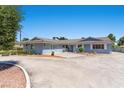 Charming single-story home with a well-maintained lawn and blue-painted exterior at 5350 Topaz St, Las Vegas, NV 89120