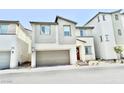 Beautiful two-story home with a covered entry, attached garage, and minimalist landscaping at 6840 Sunflower Fields St, North Las Vegas, NV 89086