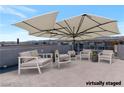 Rooftop patio featuring comfortable lounge seating and shade, perfect for enjoying outdoor living at 8144 Monsoon Bay St, Las Vegas, NV 89113